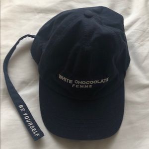 This is a baseball hat in navy with a strip